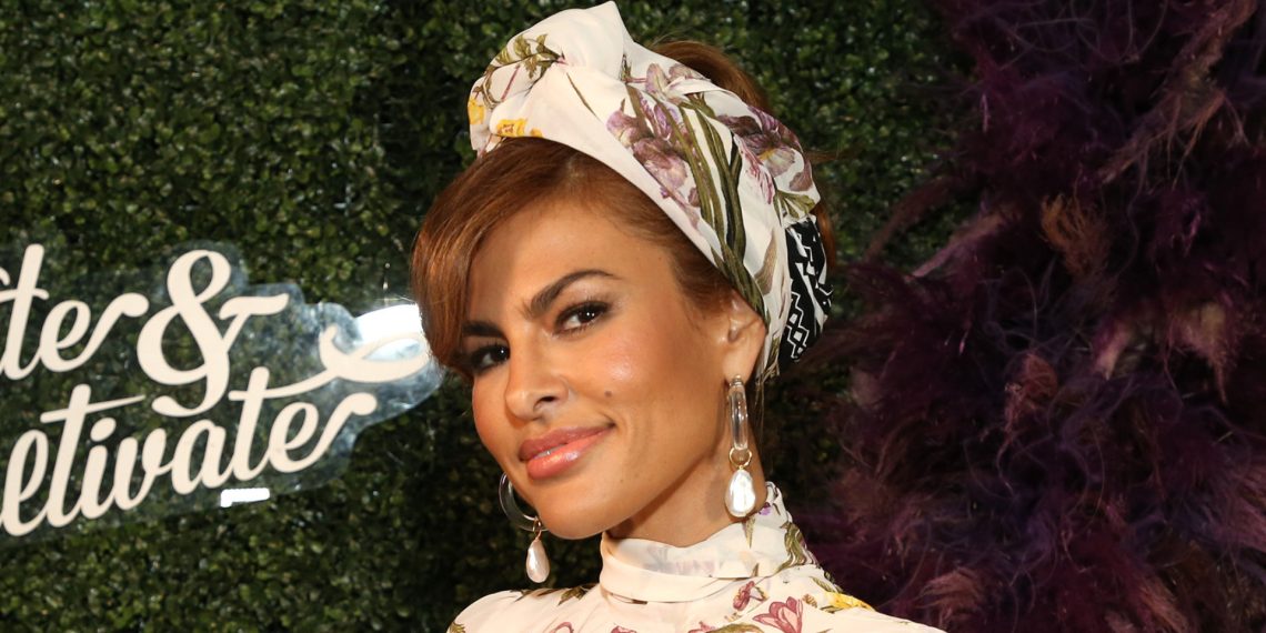 Eva Mendes nails Parisian styling in stylish navy costume and designer bag