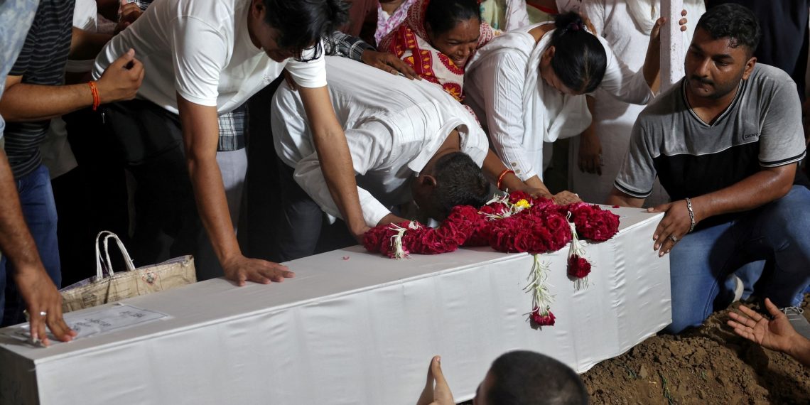 Members of the family participate within the funerals of the virtually 280 victims