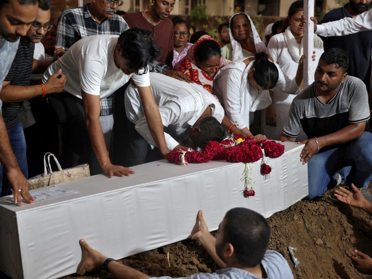 Members of the family participate within the funerals of the virtually 280 victims