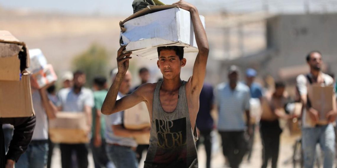 Gaza assist group says Hamas threatens it, pauses meals assist |