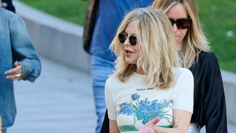Meg Ryan’s chunky boots and printed T-shirt really feel just like the contemporary approach to put on tailoring in 2025