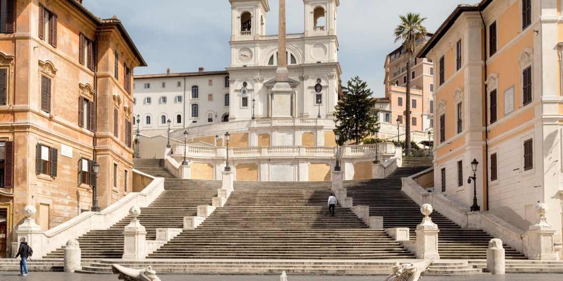 A person drove a automobile by means of the Plaza de España in Rome. Not good in any respect