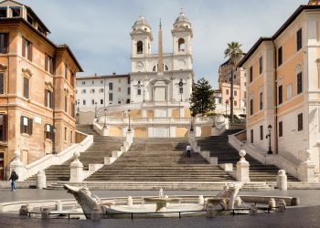 A person drove a automobile by means of the Plaza de España in Rome. Not good in any respect