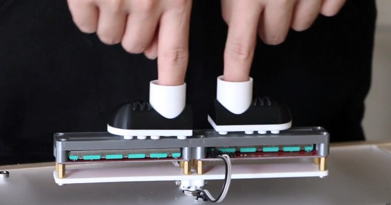 Digital Soccer Fooscade makes gamers put your fingers in mini boots