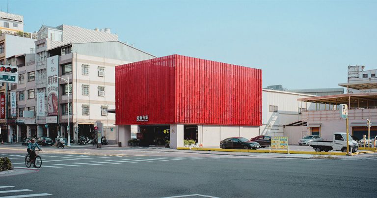 Pink steel panels surrounding a fiery facade for Taiwanese de Paperfarm restaurant