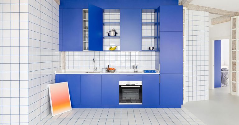 Blue and White Hyperlink interiors renovated the 1930s condominium at its seaside in Spain