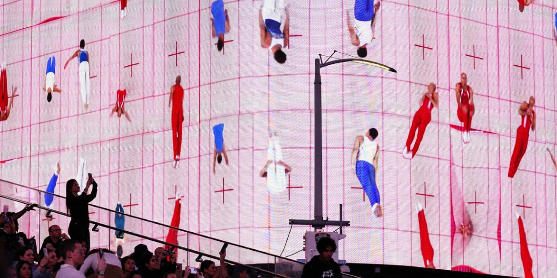 Skip Olympic gymnasts kind the takeover of Yuge Zhou Instances Sq.